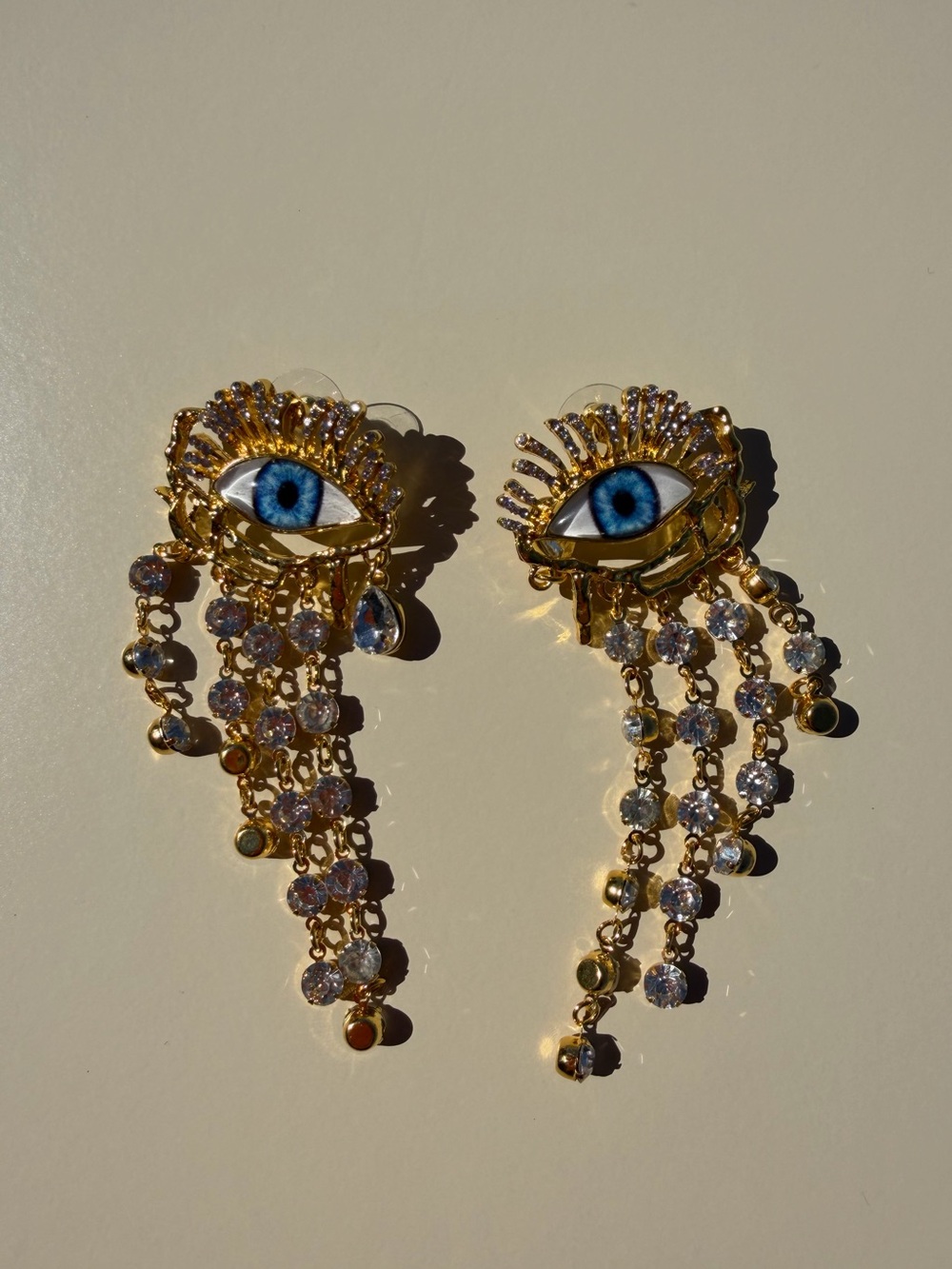 Gold-tone Blue Eye Dangle Earrings with Crystal Fringe - Picture 3 of 3